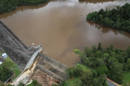 Aerial view of Enoggera Dam overflowing