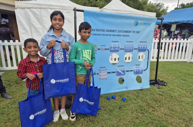 Children holding Seqwater bags